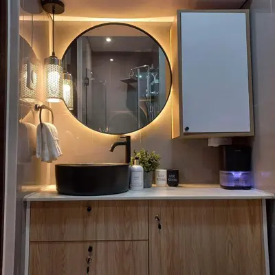 a bathroom counter with a sink and a mirror at Makati Cosy Home l Couples Families l 500Mbps Wifi in Manila