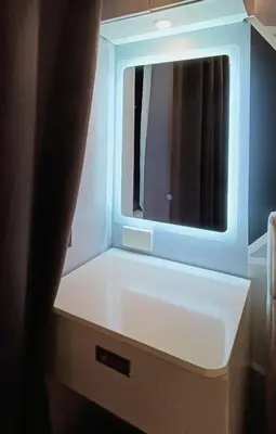 a white cabinet with a mirror on top of it at LIGHT HOUSE ( MOA STAYCATION) in Manila