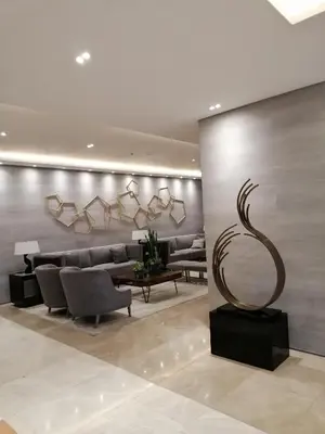 a lobby with a couch and a table and chairs at S ResidencesTower 3 - L&R Staycation in Manila