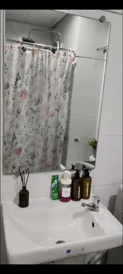 a bathroom with a sink with a mirror and a sink at S ResidencesTower 3 - L&R Staycation in Manila