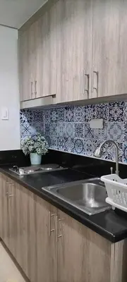 a kitchen with a sink and a counter top at S ResidencesTower 3 - L&R Staycation in Manila