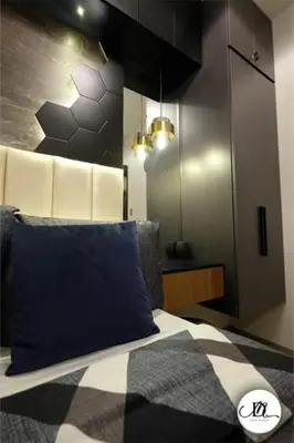 a bedroom with a blue pillow on a bed at DM's Place Family Suite B - Condo in Pasay in Manila