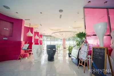 a store with pink and white walls and vases at Azure south urban beach resort near airport in Manila