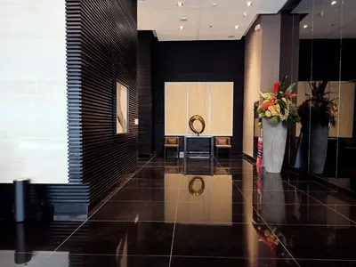 a lobby with a podium in a building at Marivic's Place at Air Residences Makati in Manila