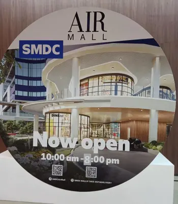 an image of an air mall sign with an air mall now open at Marivic's Place at Air Residences Makati in Manila