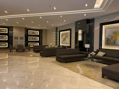 a large living room with couches and tables and chairs at Staycation Mandaluyong Fame residences greenfield district by darpm in Manila