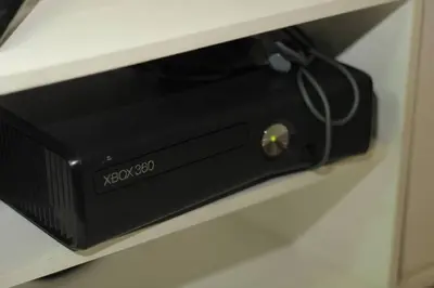 a black router sitting on top of a shelf at A2J Luxury 3BR Suite Near Uptown Mall BGC Taguig in Manila