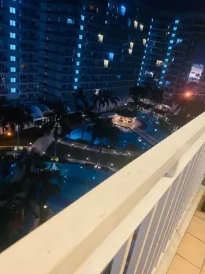 a view from the balcony of a building at night at SHELL RESIDENCE c11 SHORWALK MALL OF ASIA & AIRPORT in Manila