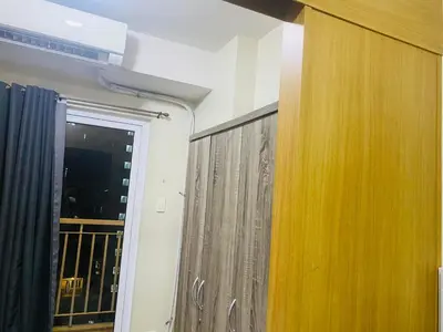 a room with a door and a window with a curtain at SHELL RESIDENCE C10 SHORWALK TO MALL OF ASIA NEAR AIRPORT in Manila