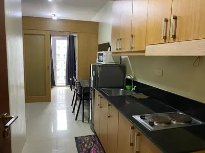 a kitchen with a sink and a counter top at SHELL RESIDENCE C10 SHORWALK TO MALL OF ASIA NEAR AIRPORT in Manila