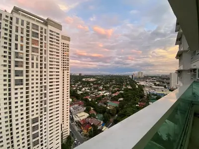 a view of a city from the balcony of a building at Family size Staycation in Makati with new year's firework balcony view in Manila