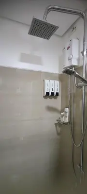 a bathroom with a shower with a shower head at Shore Residence Tower C2 in Manila