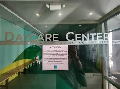 a sign on the window of a day care center at Casa Antonio at Viceroy McKinley Hill in Manila