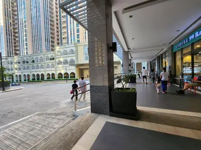 a group of people walking in a shopping mall at Casa Antonio at Viceroy McKinley Hill in Manila