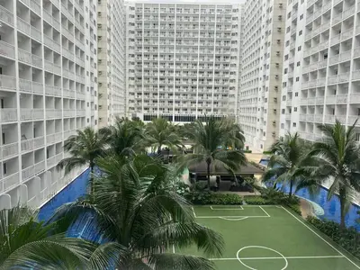 an aerial view of a tennis court in front of tall buildings at SHORE RESIDENCE D9 Shortwalk Mall of Asia Near Airport in Manila