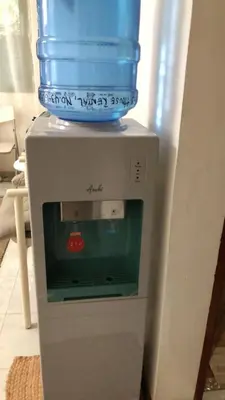 a blue water jug on top of a refrigerator at THE MANSION: 18 PAX BUDGET NEAR AIRPORT TERMINAL PASAY in Manila