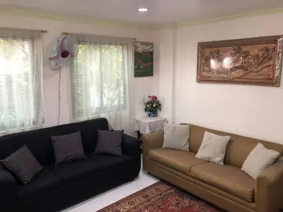 a living room with two couches and a couch at THE MANSION: FAMILY AND BARKADA BONDING PLACE IN PASAY NEAR AIRPORT in Manila
