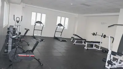 a gym with several tread machines in a room at CONDOMINIUM AT TAFT AVENUE, MALATE, Manila in Manila