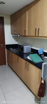 a kitchen with a counter with a microwave on it at Jamaica's Place 1br Amenities View at Shell Residences in Manila