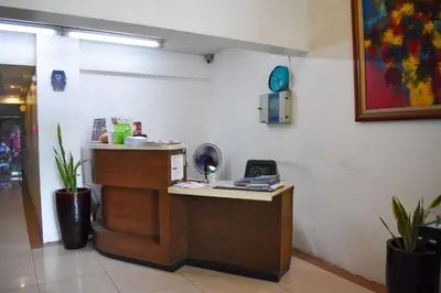 a restaurant with a counter with a phone on it at The Boni Tower by RSPL Manila City Center in Manila