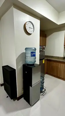 a clock on a wall next to a room at TresMariasCrib 3BR Unit at Pasig City Philippines in Manila