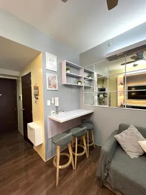 a bedroom with a bed and a sink and a counter at Apartment in Air Residences, Makati with wifi, Netflix, pool, mall and more in Manila