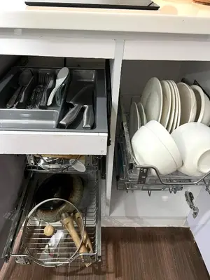 a kitchen drawer filled with plates and dishes at Apartment in Air Residences, Makati with wifi, Netflix, pool, mall and more in Manila