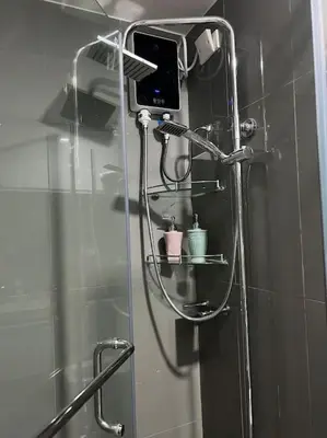 a shower in a bathroom with a glass shower backdoor at Apartment in Air Residences, Makati with wifi, Netflix, pool, mall and more in Manila