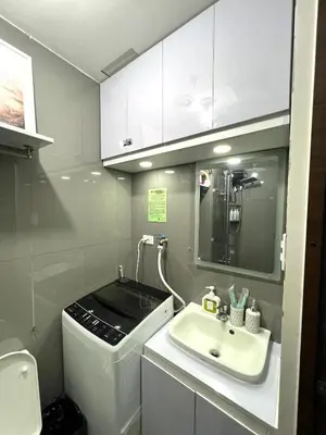 a small bathroom with a sink and a sink at Apartment in Air Residences, Makati with wifi, Netflix, pool, mall and more in Manila