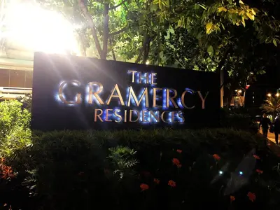 a sign that reads the grangerreasures is lit up at The Gramercy Residences in Manila