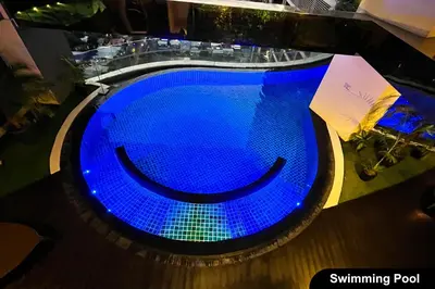 an overhead view of a blue swimming pool at The Gramercy Residences in Manila