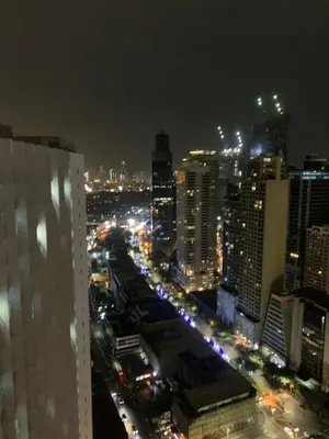 a view of a city at night with traffic at BCP Homes in Manila