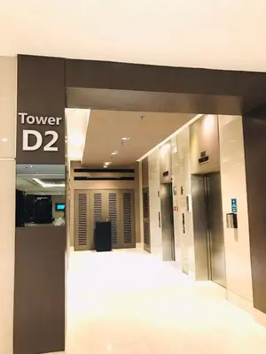 a hallway in a building with a tower sign at Shore Residence condotel,Pasay city Philippines in Manila