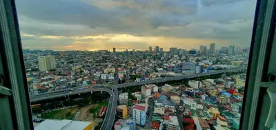 a view of a city from a skyscraper at Sea-Sky Perch Suite in Manila