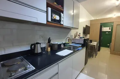 a kitchen with a sink and a counter top at simple and affordable staycation at SHORE RESIDENCES in Manila