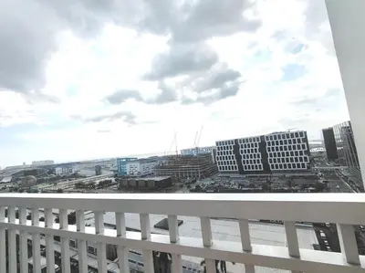 a view of a city from a balcony at Shore One Condotel At Mall of Asia, Philippines in Manila