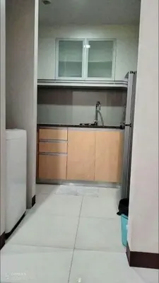 an empty kitchen with a sink and a sink at 101 Newport Boulevard near NAIA Terminal 3 in Manila
