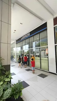 a group of people standing outside of a building at 101 Newport Boulevard near NAIA Terminal 3 in Manila