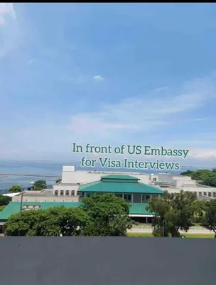 a sign that reads in front of us embassy for vtexas interagency at Grand Riviera Suites, US Embassy Comfy, Affordable Studio in Roxas Blvd, Ermita Manila in Manila