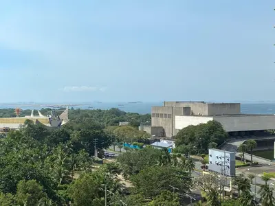 a view of a city with the ocean in the background at Le 10 The Radiance Manila Bay in Manila