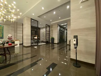 a lobby with a phone in the middle of a building at Le 10 The Radiance Manila Bay in Manila