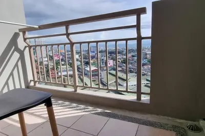 a balcony with a view of a city at Apartment in Pasig in Manila
