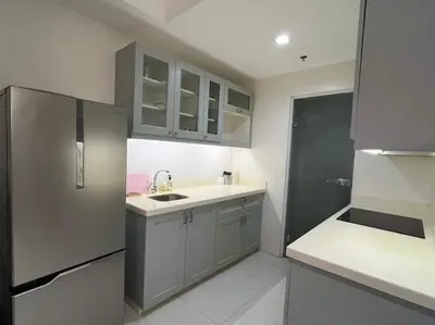 a kitchen with a sink and a refrigerator at US Embassy Roxas Blvd, Ermita, Manila 1 Bedroom ComfySuite in Manila