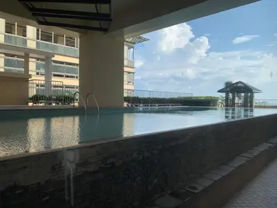 a swimming pool in the middle of a building at US Embassy Roxas Blvd, Ermita, Manila 1 Bedroom ComfySuite in Manila