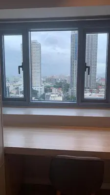 a window with a view of a city skyline at US Embassy Roxas Blvd, Ermita, Manila 1 Bedroom ComfySuite in Manila