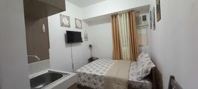 a small room with a bed and a sink at JJMC HOMESTAY 36 With Netflix and Unli Wifi in Manila