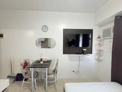 a small dining room with a table and chairs at JJMC HOMESTAY 36 With Netflix and Unli Wifi in Manila