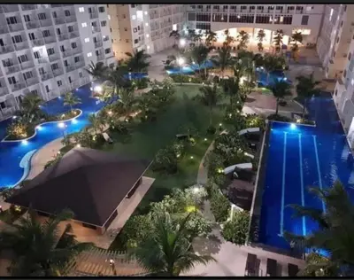 an aerial view of a resort with a pool at Shore 1 Residences Staycation By Ms Chona in Manila