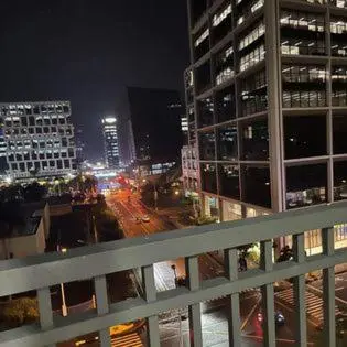 a view of a city at night with buildings at Shore 1 Residences Staycation By Ms Chona in Manila