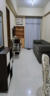 a living room with a couch and chairs at MRMCONDOTEL in Manila